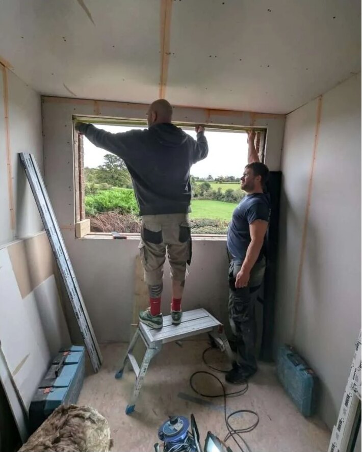 Gate5 Design tradespeople fitting a window opening