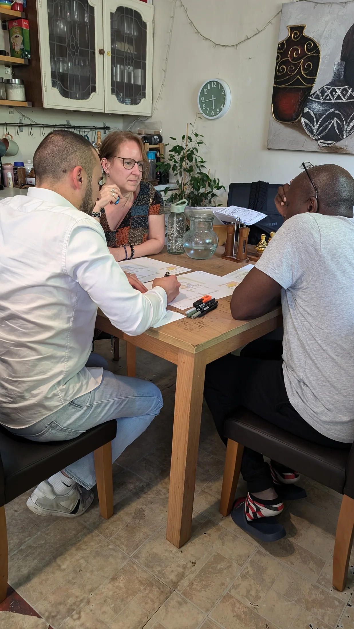 Gate5 discussing layout options with the homeowners