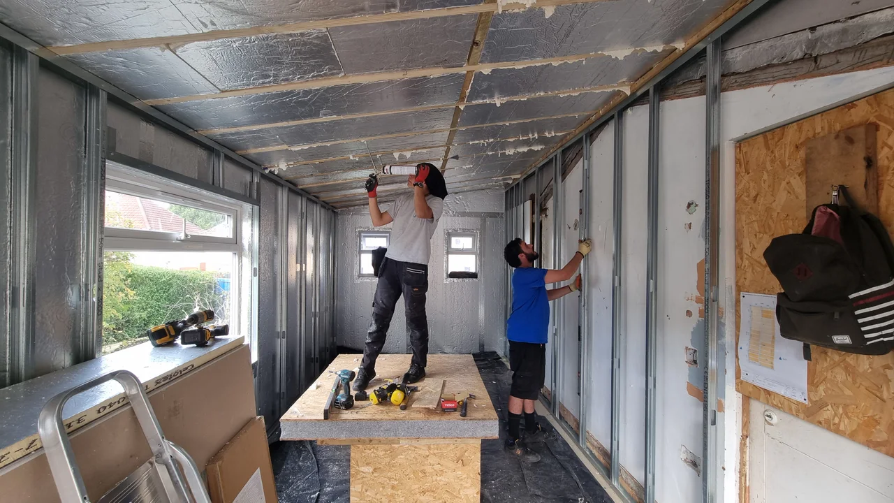 Gate5 team installing insulation and internal framing during the Brislington home extension