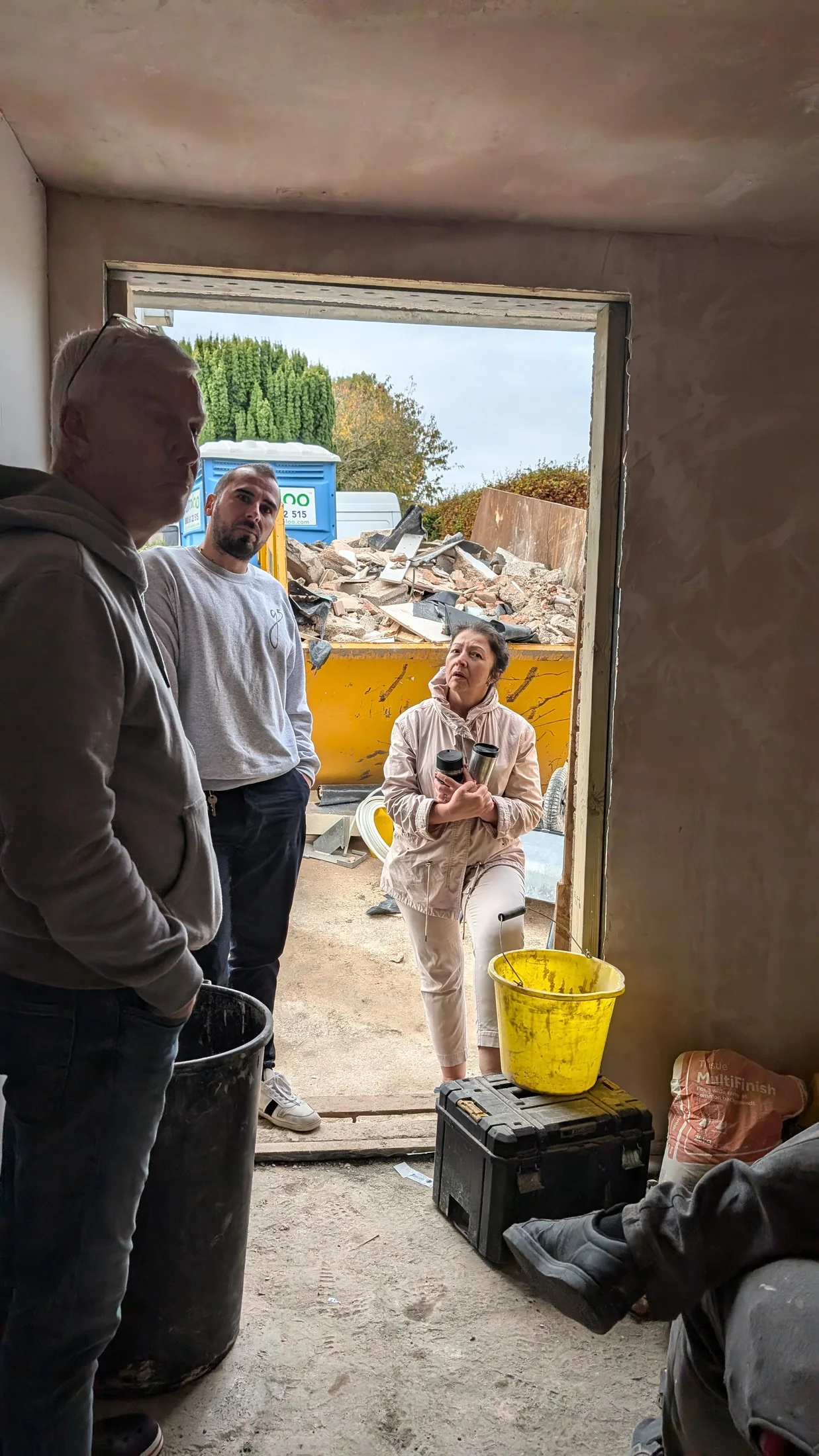 Project team reviewing the interior and entrance opening