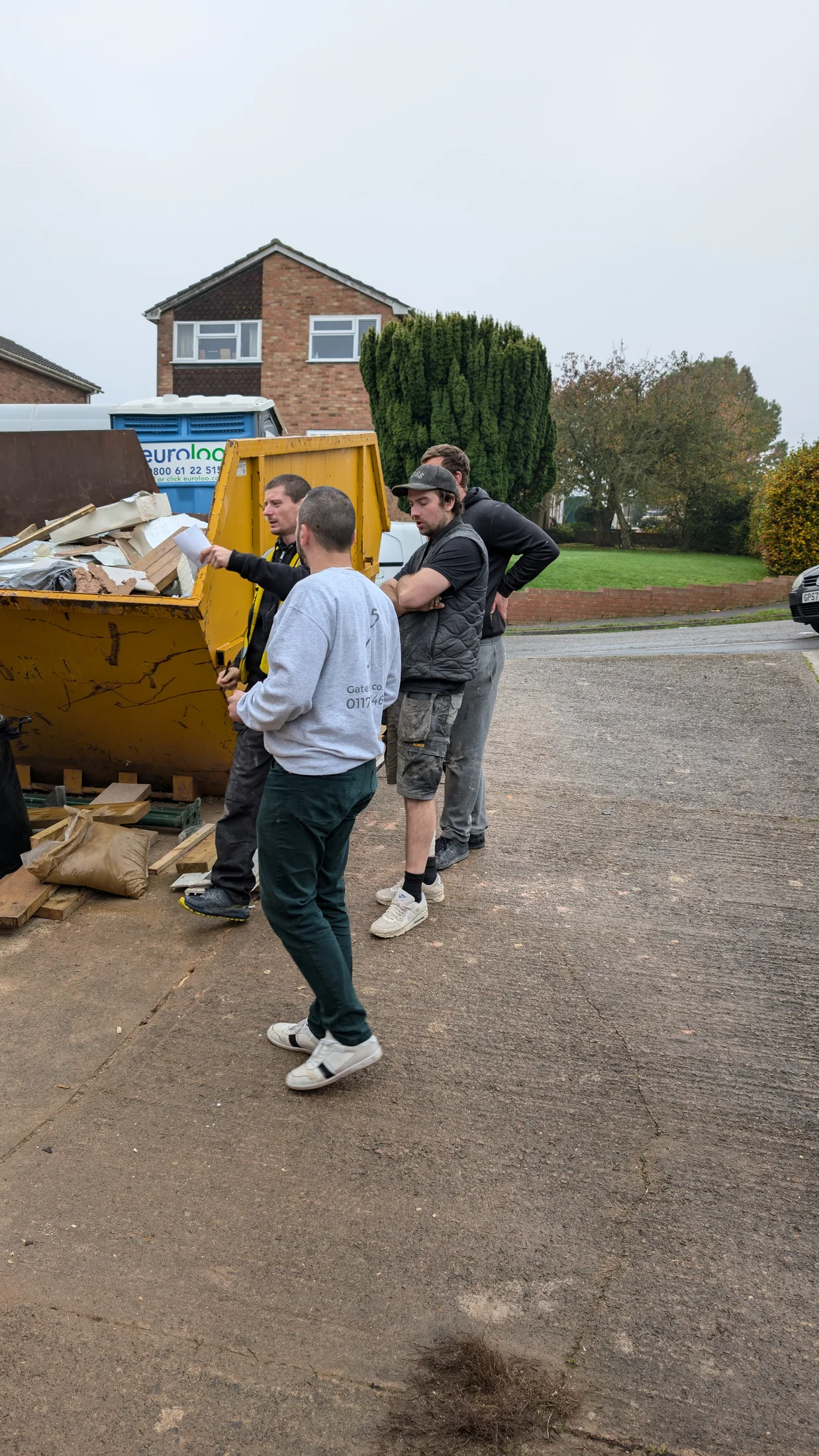 Project discussion outside the garage during work on site