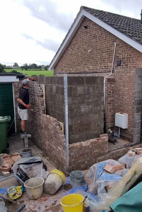 Brick garage structure and openings during the initial construction work