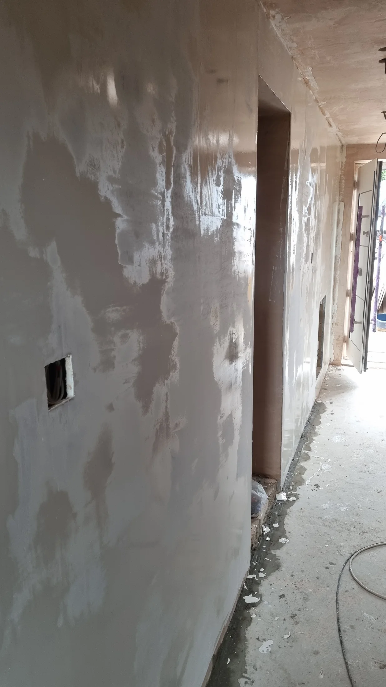 Plastered wall surfaces inside the garage conversion