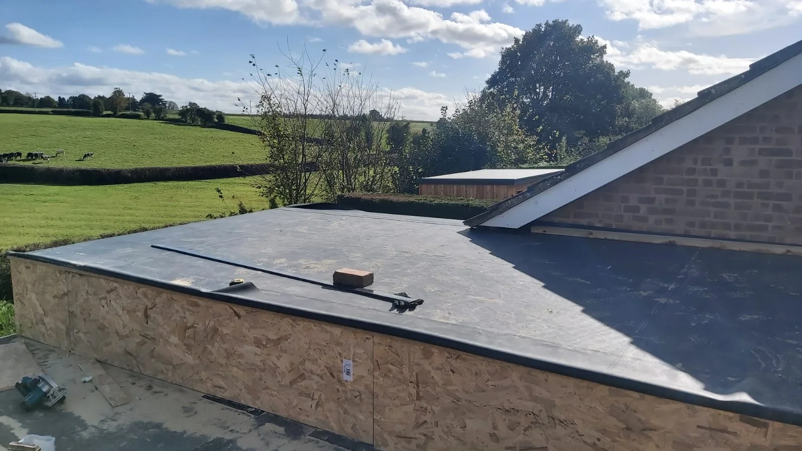 Completed flat roof covering on the enlarged garage