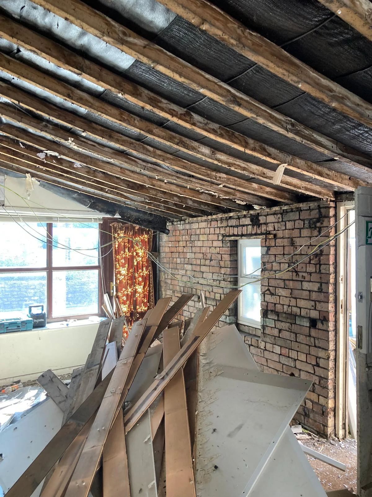 Original garage interior with exposed ceiling and masonry