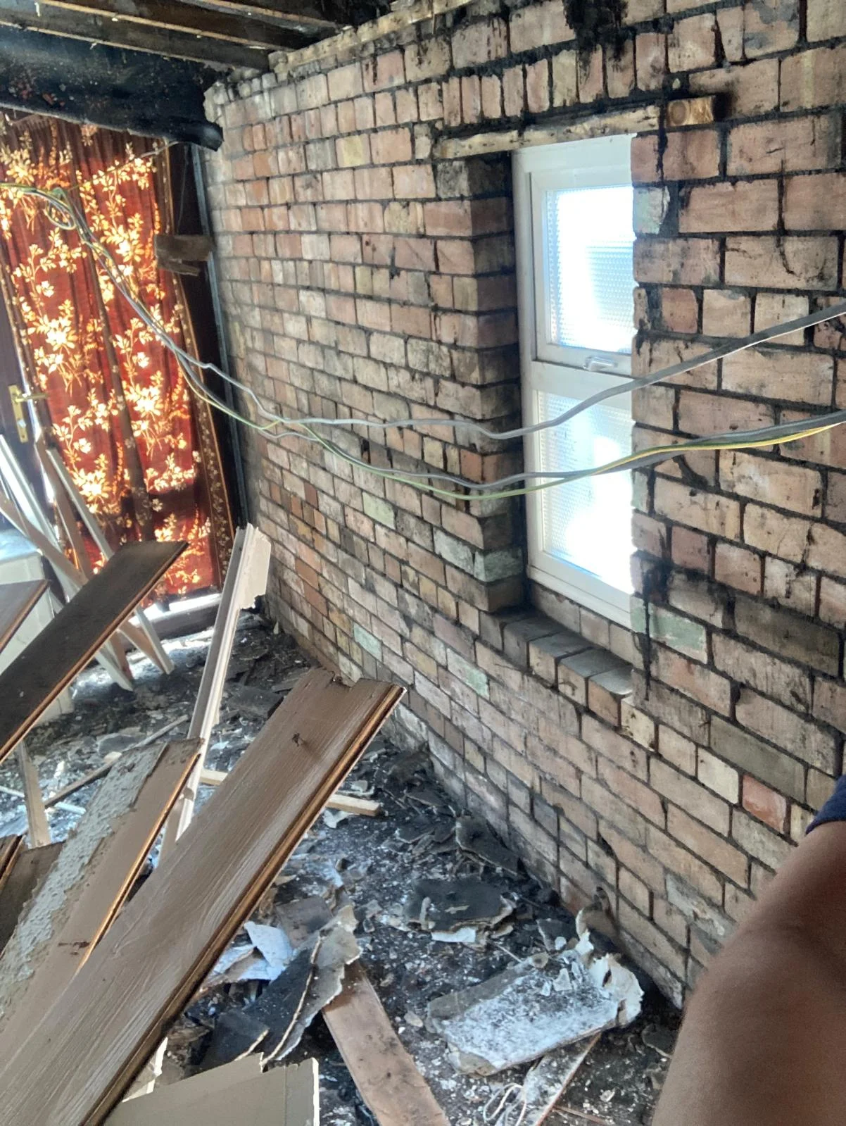 Existing brick wall and window before refurbishment