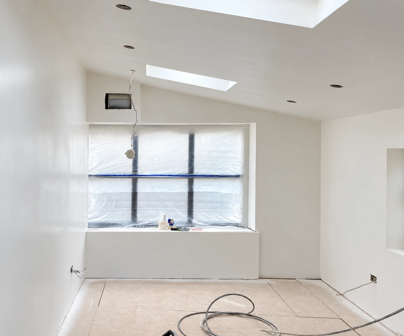 Garage conversion in Paulton during decoration, with rooflights and a protected window