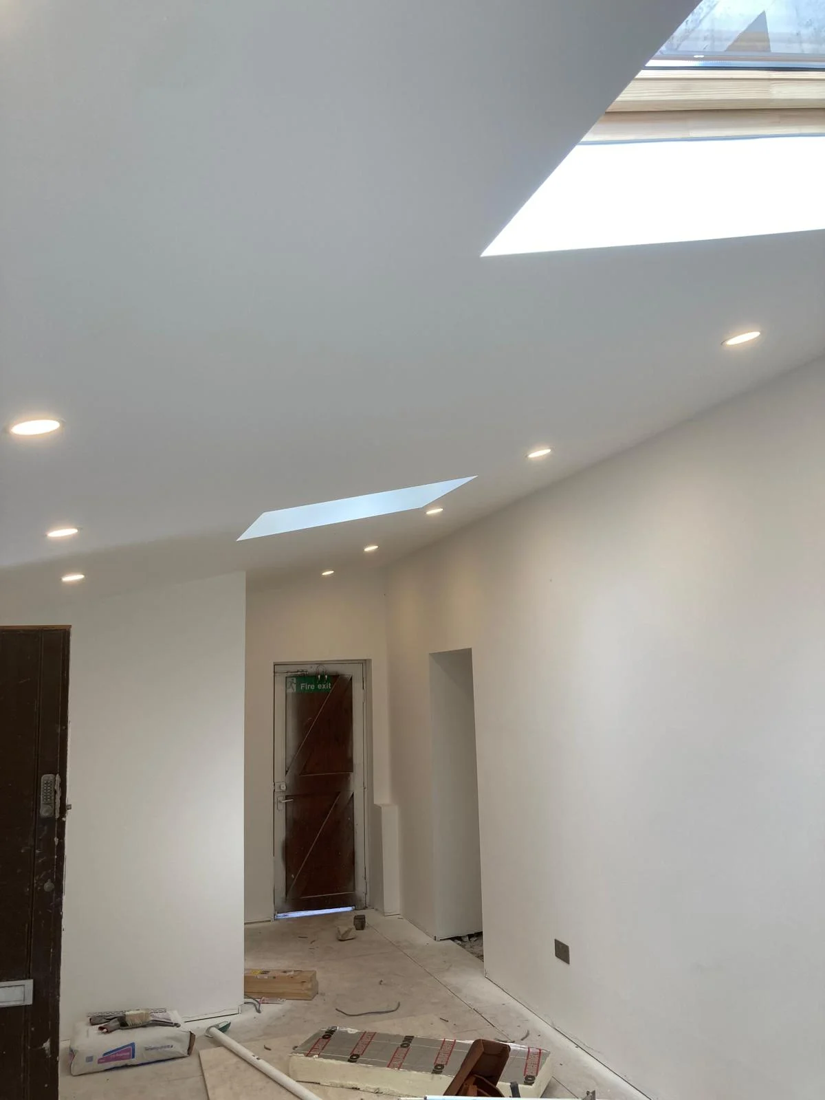 Decorated ceiling with rooflights and recessed lighting