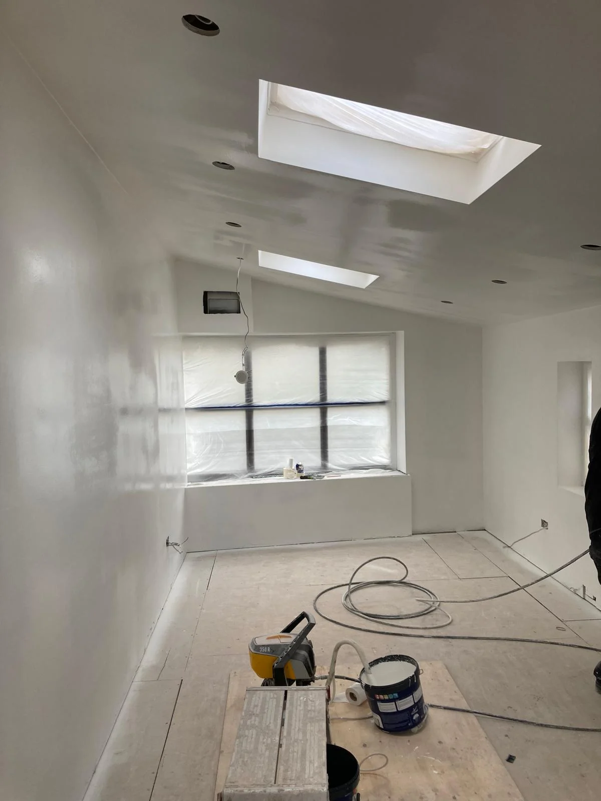 Painted interior with rooflights and front window