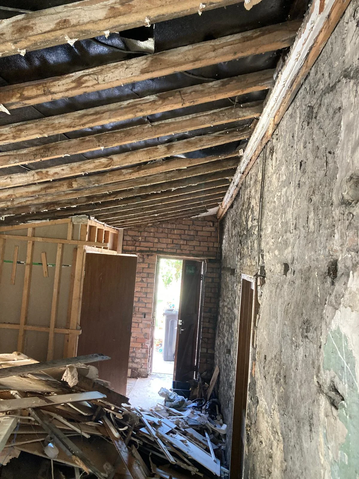 Exposed original roof timbers inside the garage