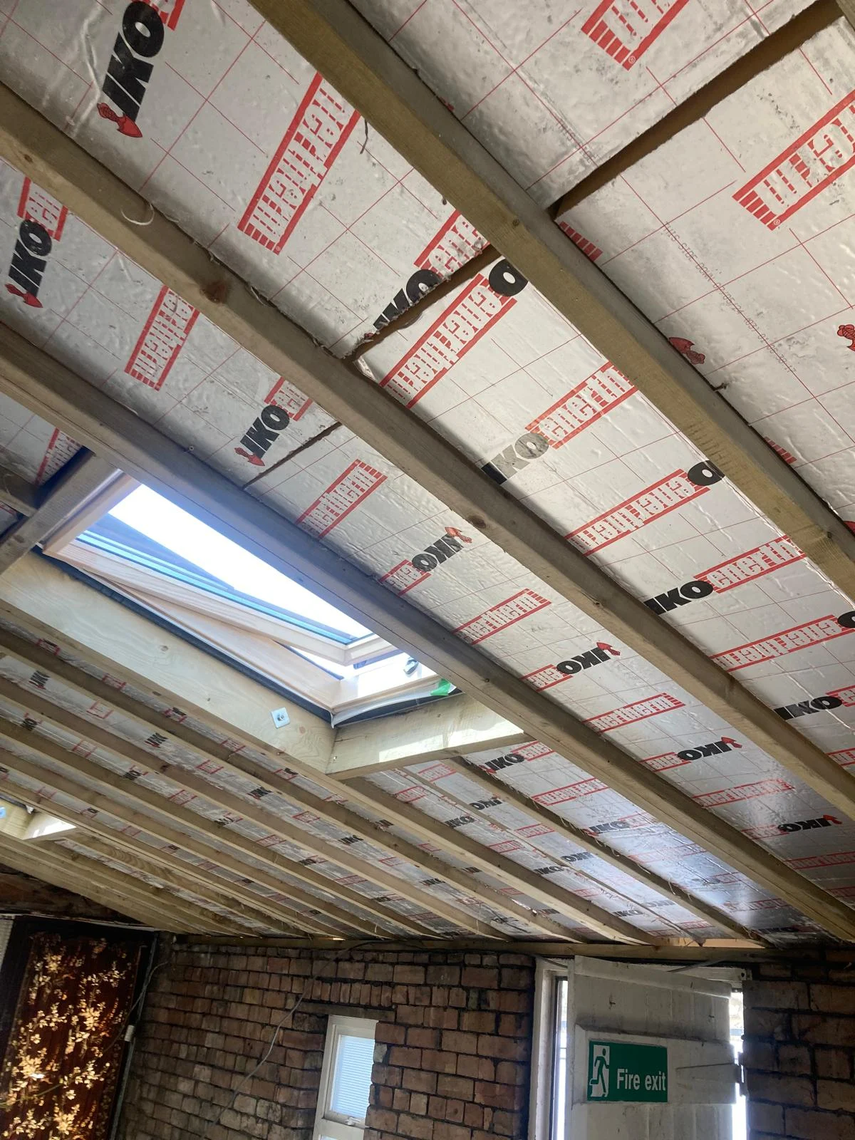 Insulated roof around a new rooflight
