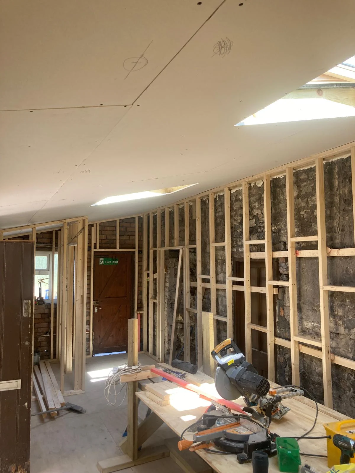 Timber wall framing beneath the rooflights